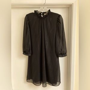 Short chiffon black dress with sparkle lines, black slip attached. Brand new